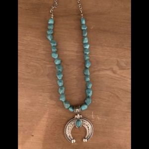 Beaded turquoise necklace with silver medallion